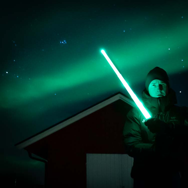 Star Wars lightsaber under Northern lights at Sommarøy Tromsø Norway